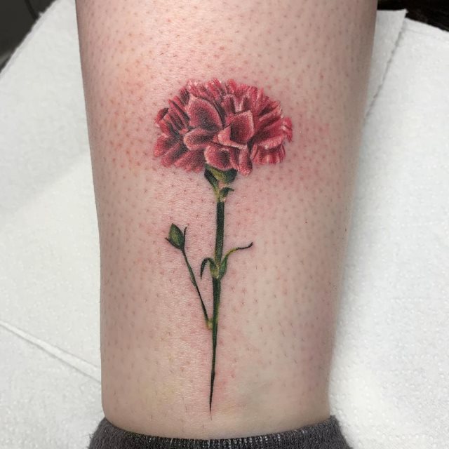 tattoo femenino flor en la pierna 10