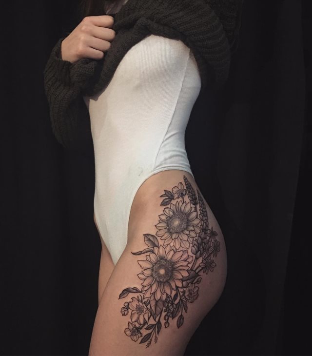 tattoo femenino flor en la pierna 19