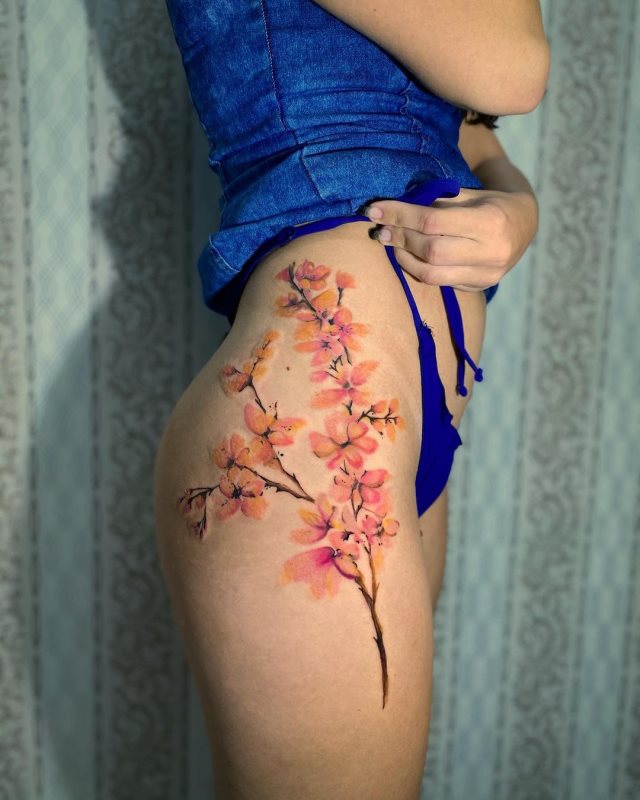 tattoo femenino flor en la pierna 40